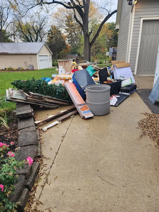 Dumpster being loaded with debris for Demolition Dumpster Rental in Englewood